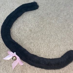 Black cat tail with bell and bow